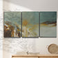 Three-panel canvas wall art featuring earth toned abstract solar landscape, displayed in a minimalist living room above a console table.