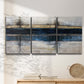 Three-panel canvas wall art featuring abstract blue urban composition, displayed in a minimalist living room above a console table.