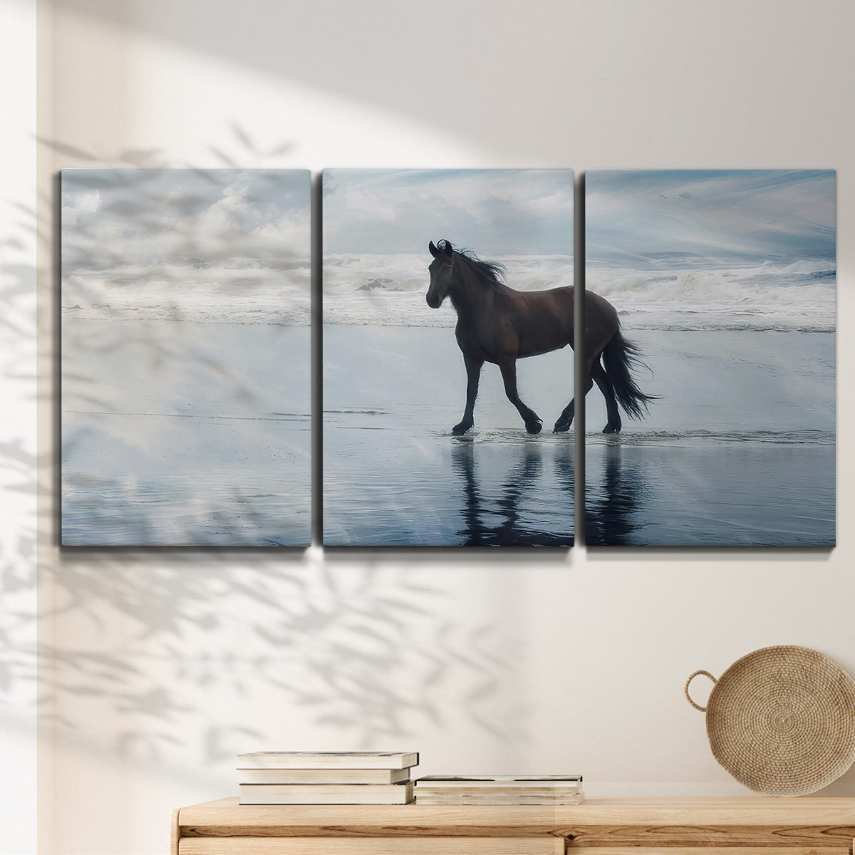 Three-panel canvas wall art featuring running horses captured mid stride, displayed in a minimalist living room above a console table.