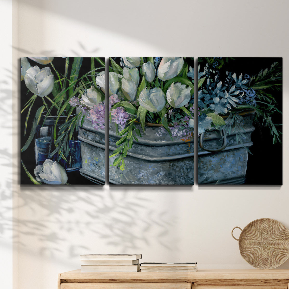 Three-panel canvas wall art featuring colorful wild tulips in bloom, displayed in a minimalist living room above a console table.