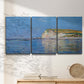Three-panel canvas wall art featuring white cliffs rising above sea, displayed in a minimalist living room above a console table.