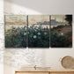 Three-panel canvas wall art featuring formal garden near museum grounds, displayed in a minimalist living room above a console table.