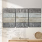 Three-panel canvas wall art featuring beach themed typography design, displayed in a minimalist living room above a console table.