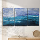 Three-panel canvas wall art featuring impressionist nautical harbor scene, displayed in a minimalist living room above a console table.