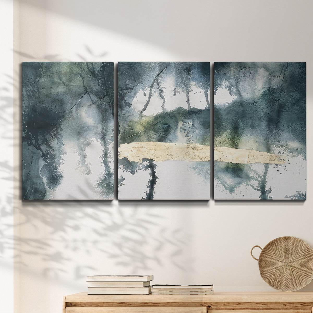 Three-panel canvas wall art featuring saturated abstract color fields, displayed in a minimalist living room above a console table.