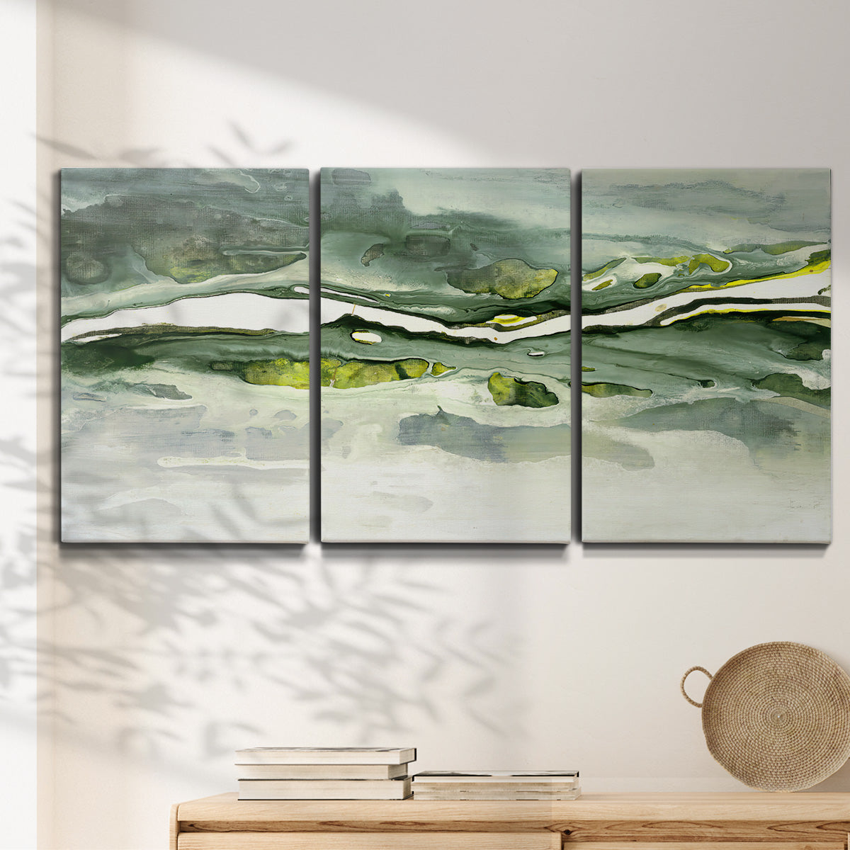 Three-panel canvas wall art featuring abstract passage of time composition, displayed in a minimalist living room above a console table.