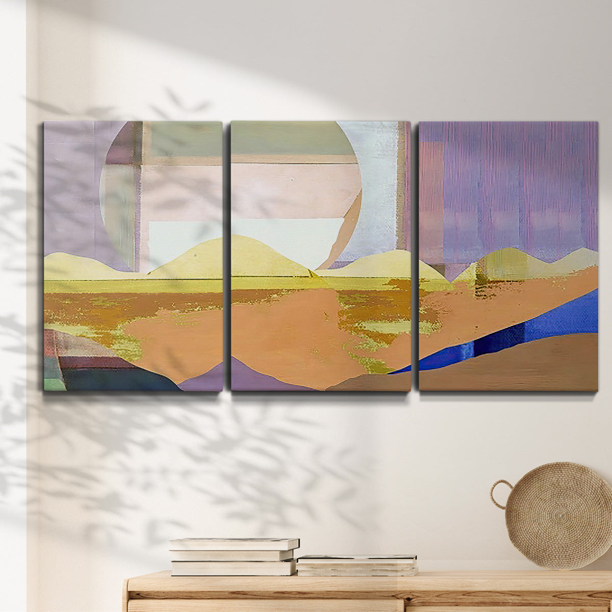 Three-panel canvas wall art featuring mid century geometric pink abstraction, displayed in a minimalist living room above a console table.