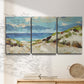 Three-panel canvas wall art featuring sand dunes beside open water, displayed in a minimalist living room above a console table.