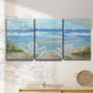 Three-panel canvas wall art featuring peaceful coastal landscape escape, displayed in a minimalist living room above a console table.