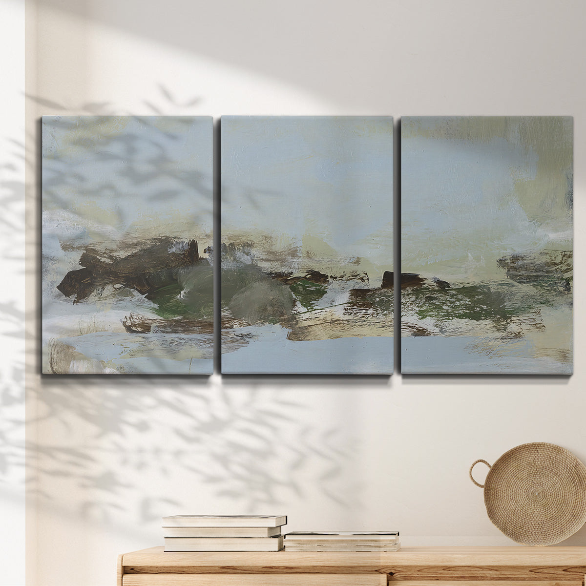 Three-panel canvas wall art featuring minimal abstract summer landscape, displayed in a minimalist living room above a console table.