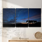 Three-panel canvas wall art featuring resting animals in open field, displayed in a minimalist living room above a console table.