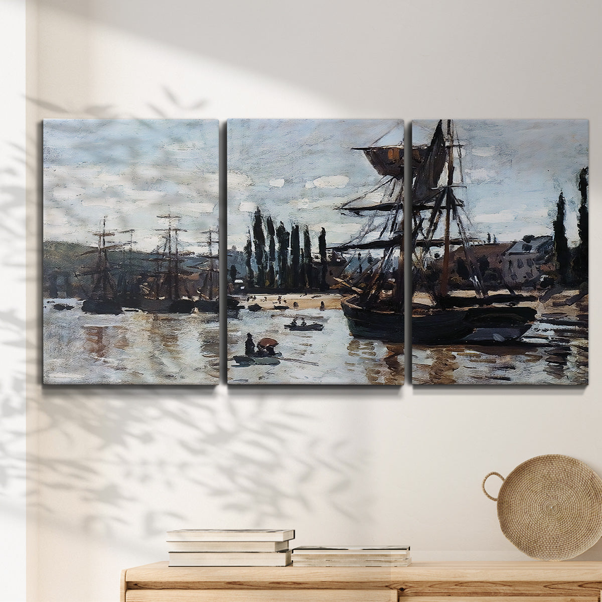 Three-panel canvas wall art featuring harbor scene with boats and quays, displayed in a minimalist living room above a console table.