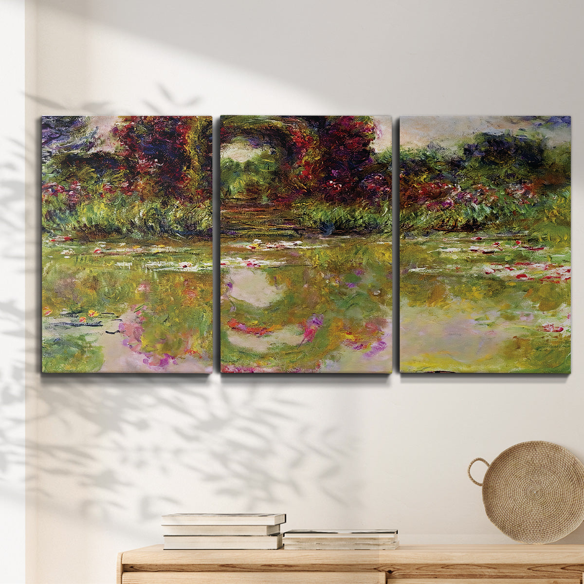 Three-panel canvas wall art featuring arched rose garden walkway, displayed in a minimalist living room above a console table.