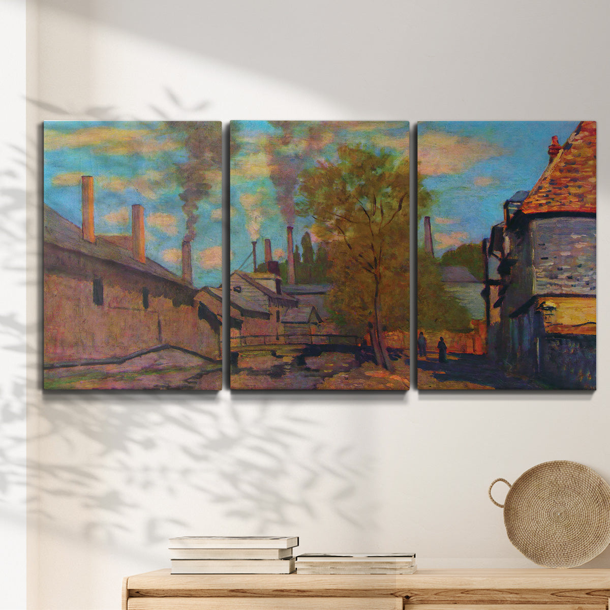 Three-panel canvas wall art featuring wooded stream landscape, displayed in a minimalist living room above a console table.