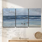 Three-panel canvas wall art featuring loose farmhouse style floral painting, displayed in a minimalist living room above a console table.