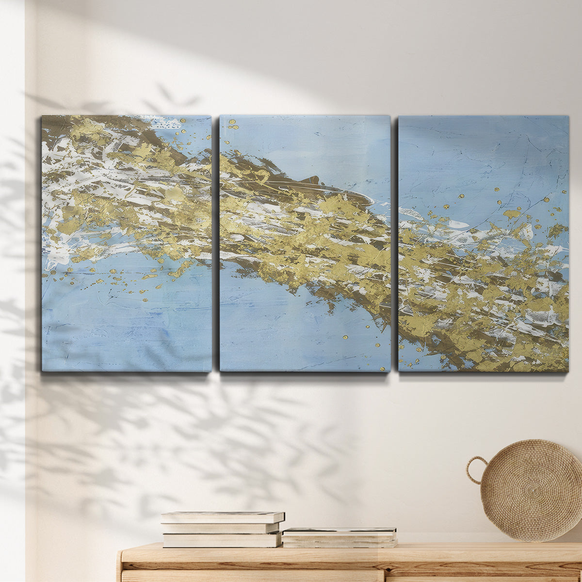 Three-panel canvas wall art featuring , displayed in a minimalist living room above a console table.