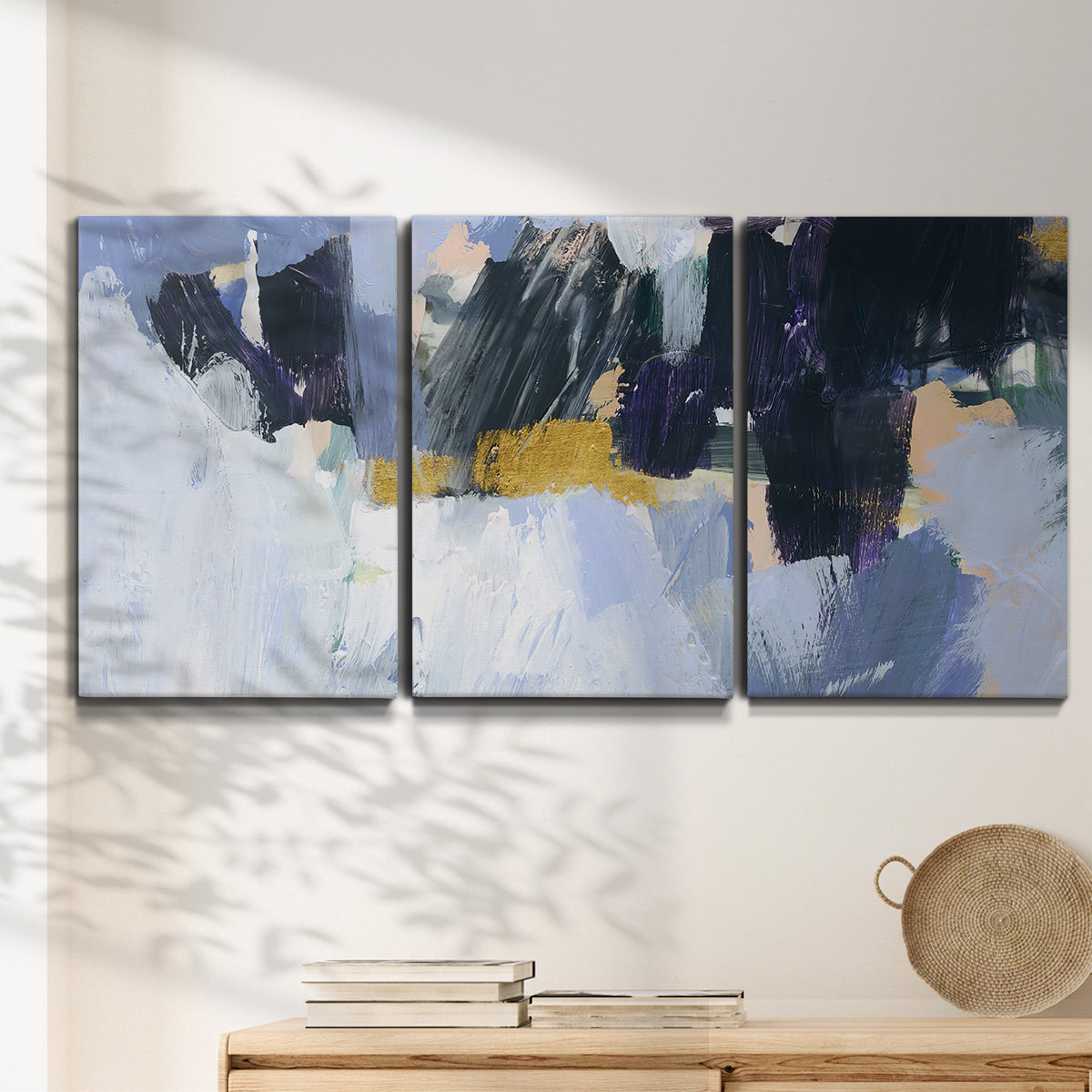 Three-panel canvas wall art featuring icy abstract arctic ledge, displayed in a minimalist living room above a console table.