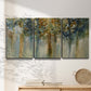 Three-panel canvas wall art featuring earth toned abstract leaf textures, displayed in a minimalist living room above a console table.