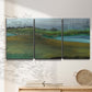 Three-panel canvas wall art featuring quiet contemplative landscape scene, displayed in a minimalist living room above a console table.