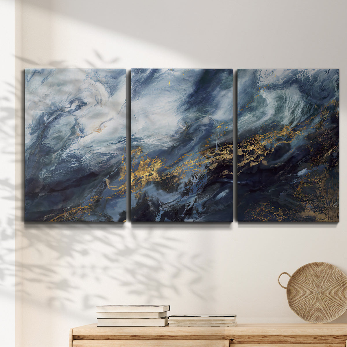 Three-panel canvas wall art featuring soft abstract landscape anticipation tones, displayed in a minimalist living room above a console table.