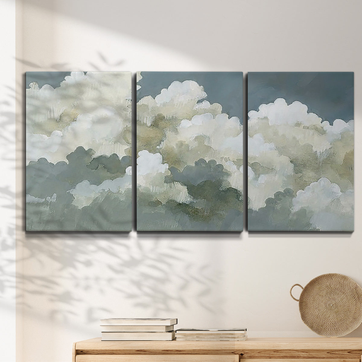 Three-panel canvas wall art featuring abstract evening landscape with depth, displayed in a minimalist living room above a console table.