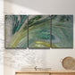Three-panel canvas wall art featuring layered modern abstract landscape, displayed in a minimalist living room above a console table.
