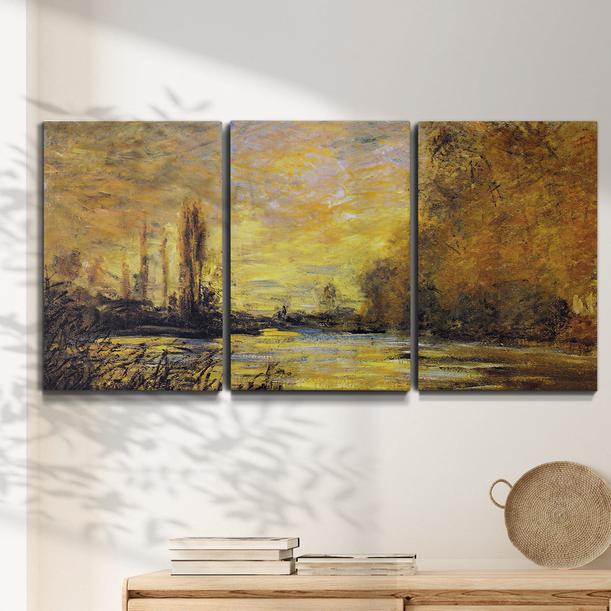 Three-panel canvas wall art featuring quiet river branch landscape, displayed in a minimalist living room above a console table.