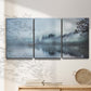 Three-panel canvas wall art featuring calm waters at sunrise photograph, displayed in a minimalist living room above a console table.