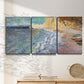 Three-panel canvas wall art featuring figures along rocky beach, displayed in a minimalist living room above a console table.