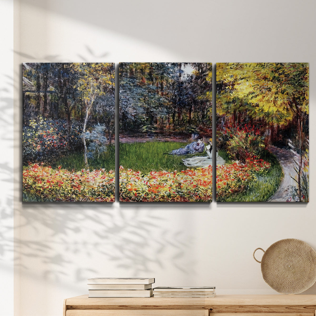 Three-panel canvas wall art featuring garden in full bloom by coast, displayed in a minimalist living room above a console table.