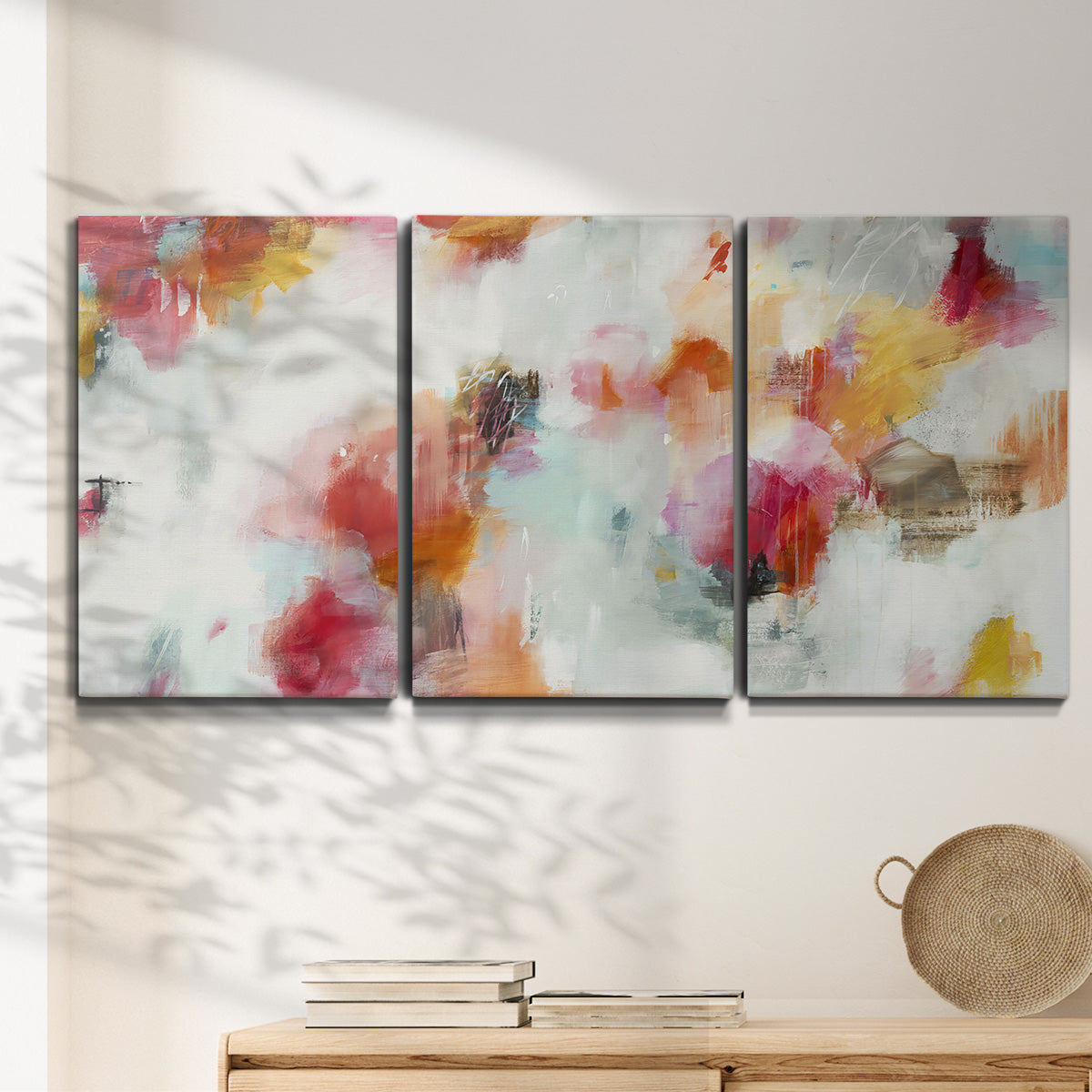 Three-panel canvas wall art featuring abstract directional visual shift, displayed in a minimalist living room above a console table.