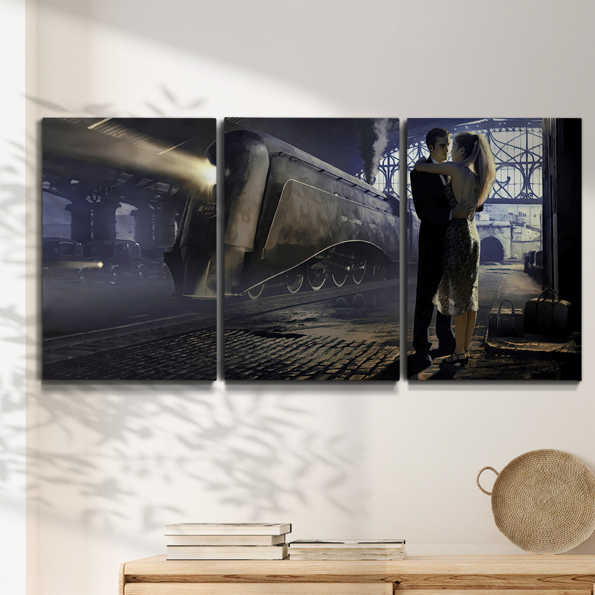 Three-panel canvas wall art featuring couple kissing at train station, displayed in a minimalist living room above a console table.
