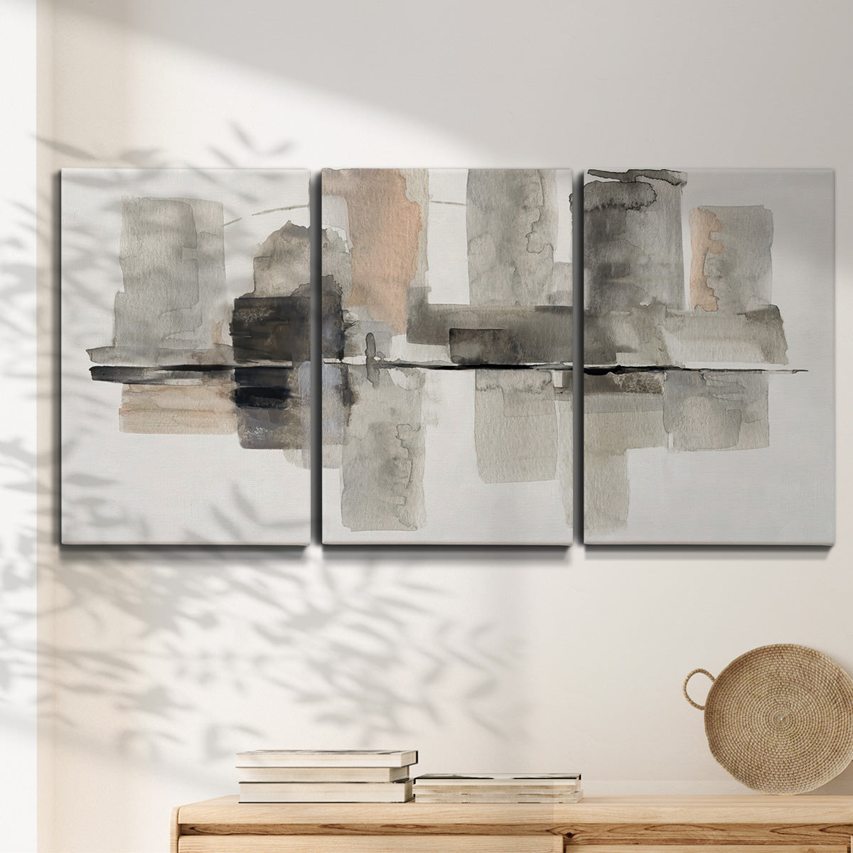 Three-panel canvas wall art featuring urban abstract watercolor oasis, displayed in a minimalist living room above a console table.