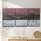 Three-panel canvas wall art featuring winter sunset snowfall landscape, displayed in a minimalist living room above a console table.