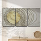 Three-panel canvas wall art featuring circular abstract energy forms, displayed in a minimalist living room above a console table.
