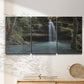 Three-panel canvas wall art featuring waterfall cascading through forest, displayed in a minimalist living room above a console table.