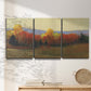 Three-panel canvas wall art featuring autumn landscape changing foliage, displayed in a minimalist living room above a console table.