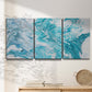 Three-panel canvas wall art featuring rocky coastal tide pool scene, displayed in a minimalist living room above a console table.