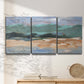 Three-panel canvas wall art featuring abstract landscape composition study, displayed in a minimalist living room above a console table.