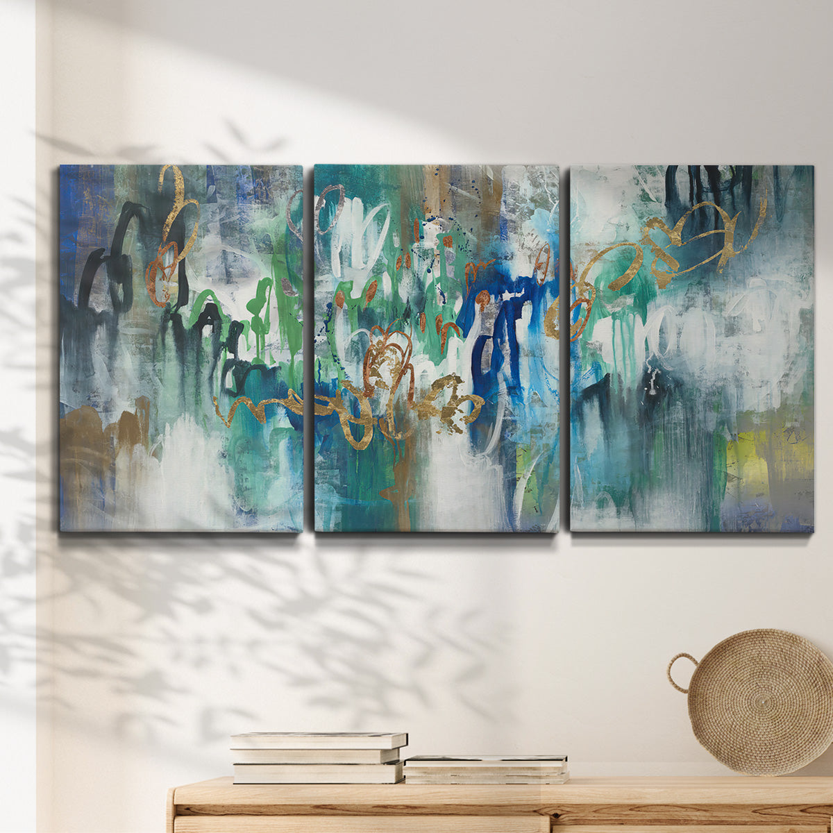 Three-panel canvas wall art featuring joyful abstract color harmony, displayed in a minimalist living room above a console table.