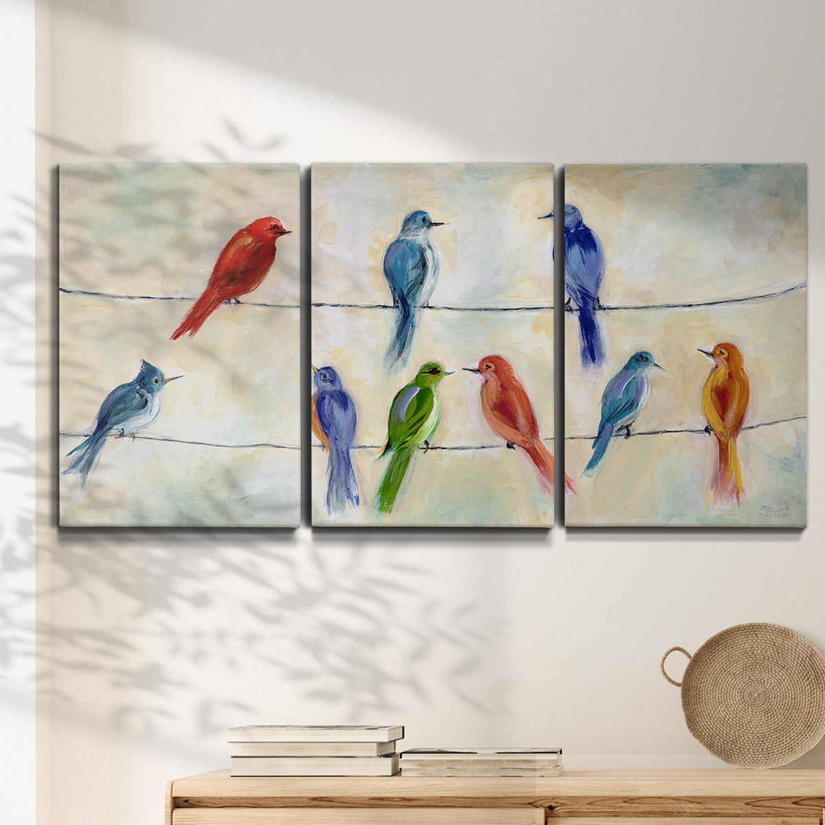 Three-panel canvas wall art featuring whimsical animal chatter illustration, displayed in a minimalist living room above a console table.