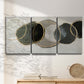 Three-panel canvas wall art featuring smooth abstract river stone forms, displayed in a minimalist living room above a console table.