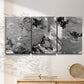 Three-panel canvas wall art featuring abstract marble texture composition, displayed in a minimalist living room above a console table.