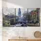 Three-panel canvas wall art featuring historic tower beside canal, displayed in a minimalist living room above a console table.