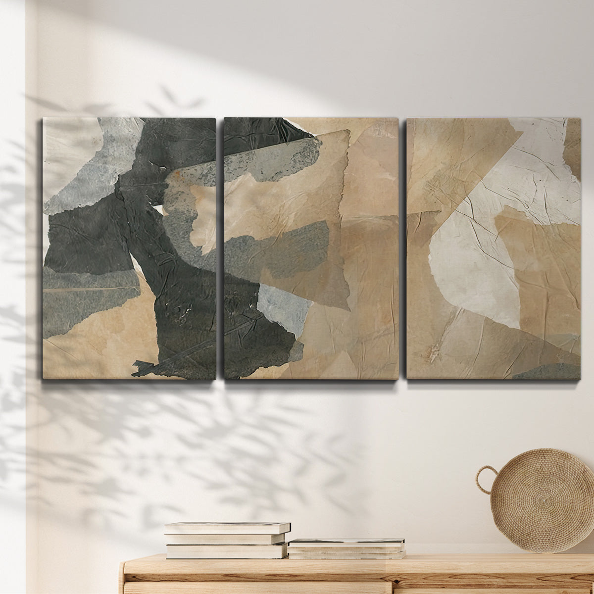 Three-panel canvas wall art featuring blurred mixed media abstract collage, displayed in a minimalist living room above a console table.