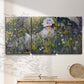 Three-panel canvas wall art featuring woman walking with parasol, displayed in a minimalist living room above a console table.