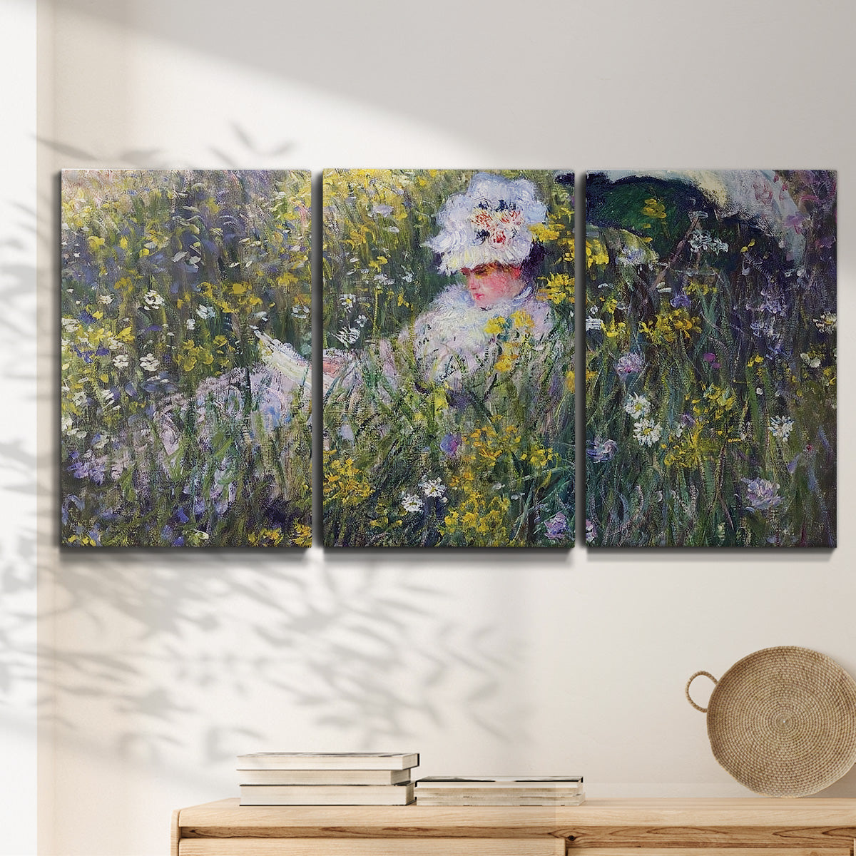 Three-panel canvas wall art featuring woman walking with parasol, displayed in a minimalist living room above a console table.