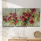Three-panel canvas wall art featuring colorful floral garden composition, displayed in a minimalist living room above a console table.