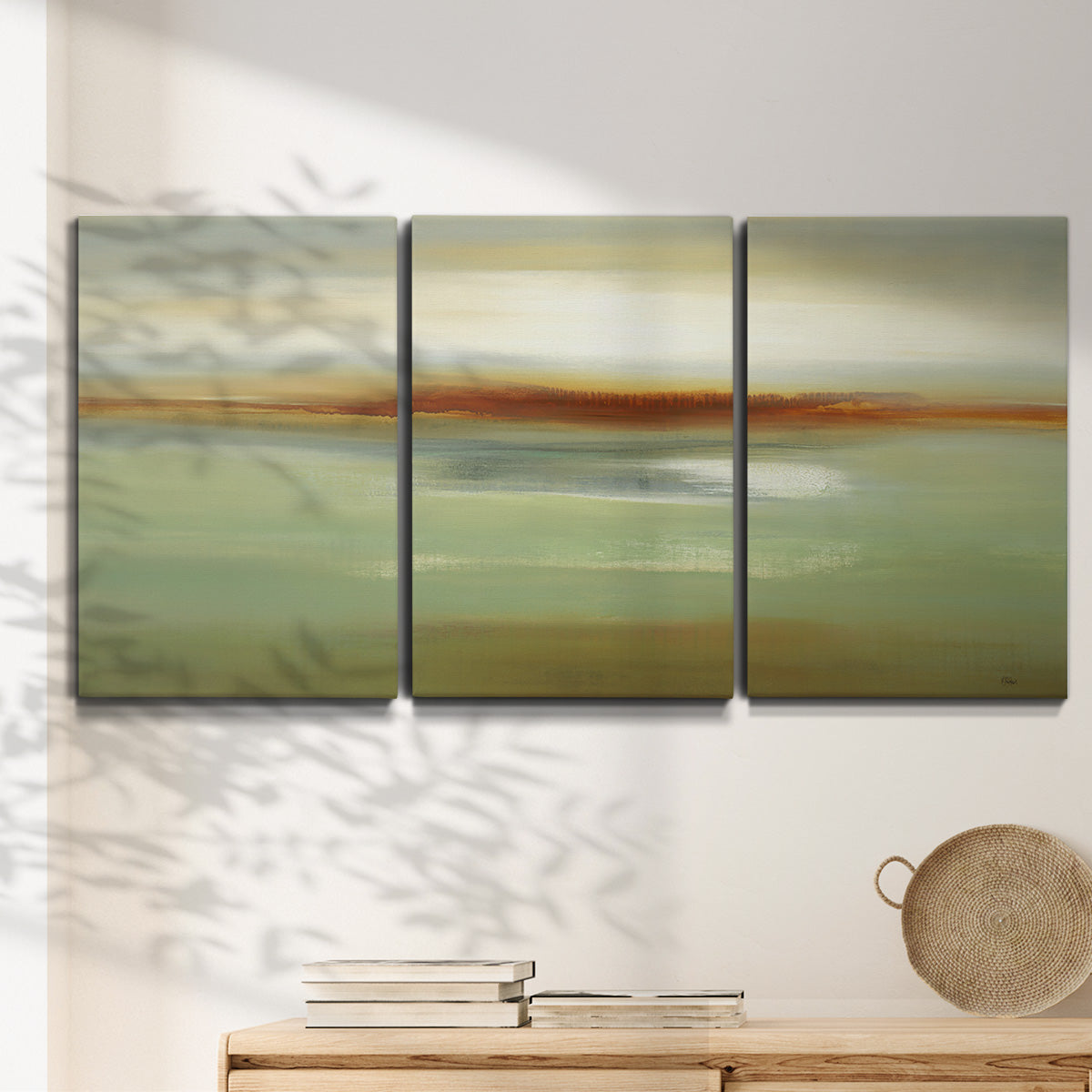 Three-panel canvas wall art featuring green focused abstract color vision, displayed in a minimalist living room above a console table.