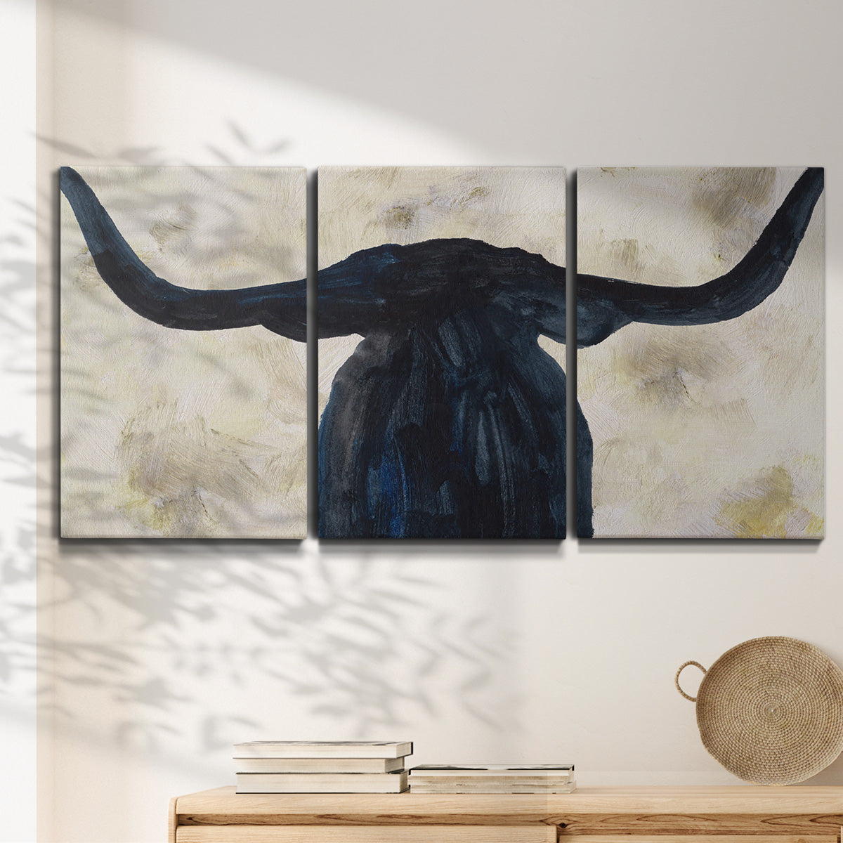Three-panel canvas wall art featuring rustic animal portrait illustration, displayed in a minimalist living room above a console table.